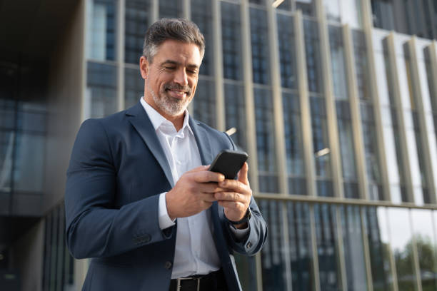 successful-mature-hispanic-senior-business-man-using-smartphone-cellphone-financial.jpg